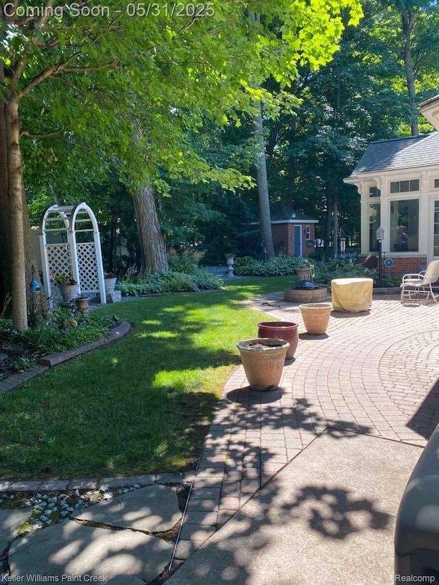 8241 Fountain View Dr, Flushing, MI 48433 - view of patio featuring an outbuilding