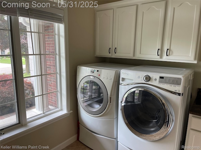 8241 Fountain View Dr, Flushing, MI 48433 - laundry room with separate washer and dryer, cabinet space, baseboards, and tile patterned floors