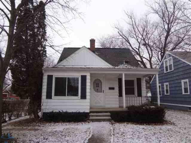 20005 Woodworth St, Redford, MI 48240 - bungalow-style home featuring covered porch and a chimney