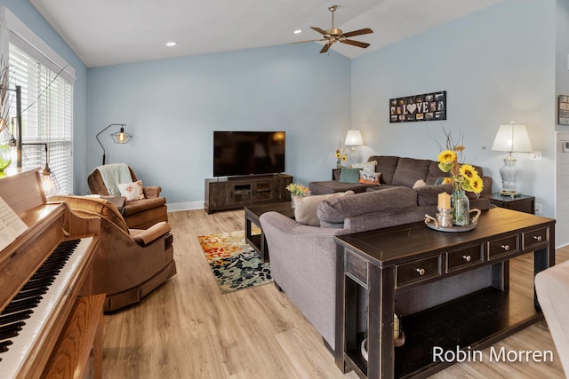 11648 Everette Ave, Allendale, MI 49401 - living area featuring a ceiling fan, light wood-type flooring, lofted ceiling, and baseboards