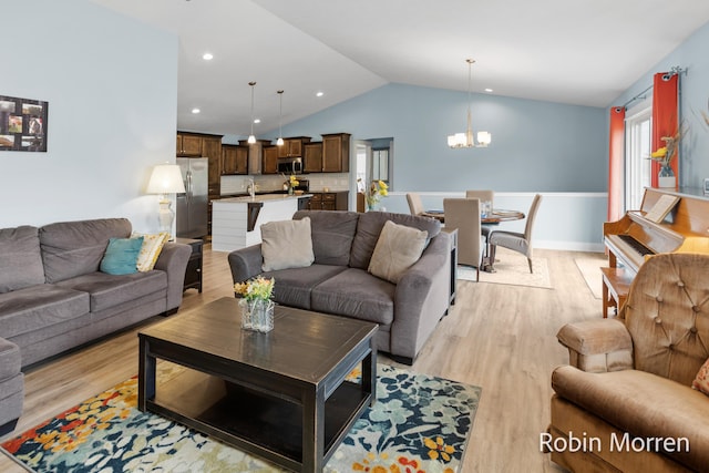 11648 Everette Ave, Allendale, MI 49401 - living area featuring a chandelier, lofted ceiling, light wood-style flooring, recessed lighting, and baseboards