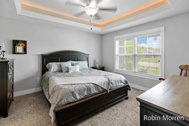 11648 Everette Ave, Allendale, MI 49401 - bedroom with a tray ceiling, light carpet, baseboards, a ceiling fan, and crown molding