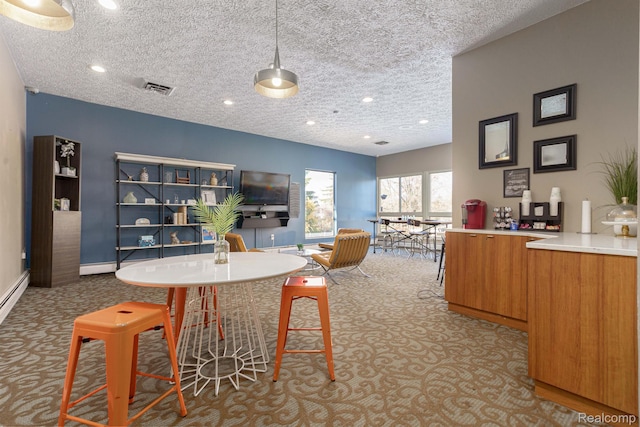930 Village Green Ln, Waterford, MI 48328 - carpeted dining area with a textured ceiling, baseboards, and recessed lighting