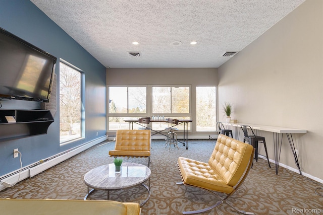 930 Village Green Ln, Waterford, MI 48328 - carpeted living area featuring a textured ceiling, plenty of natural light, baseboards, a baseboard heating unit, and recessed lighting