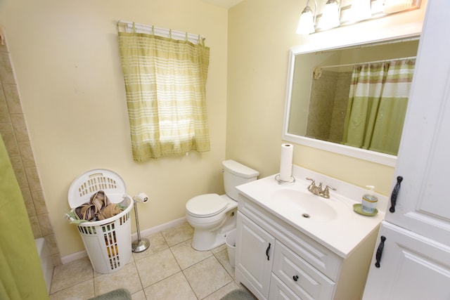 3215 Mackin Rd, Flint, MI 48504 - bathroom featuring tile patterned floors, toilet, baseboards, and vanity