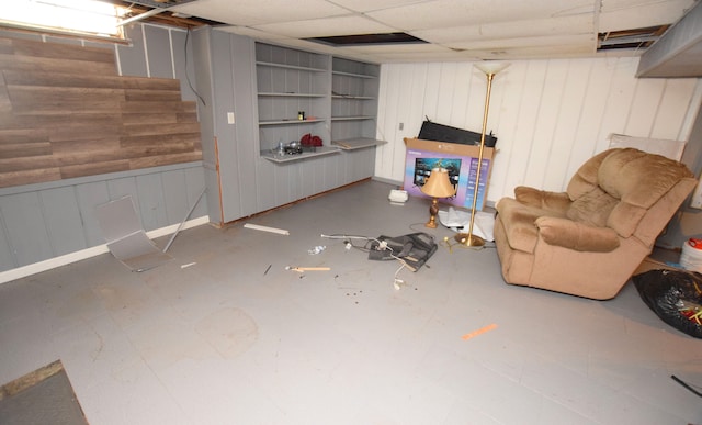 3215 Mackin Rd, Flint, MI 48504 - finished basement with built in shelves, stairs, and wood walls