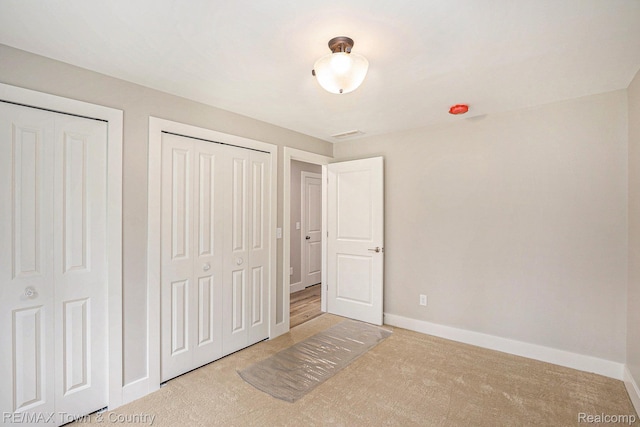 6400 N Seymour Rd, Flushing, MI 48433 - unfurnished bedroom featuring baseboards and carpet floors