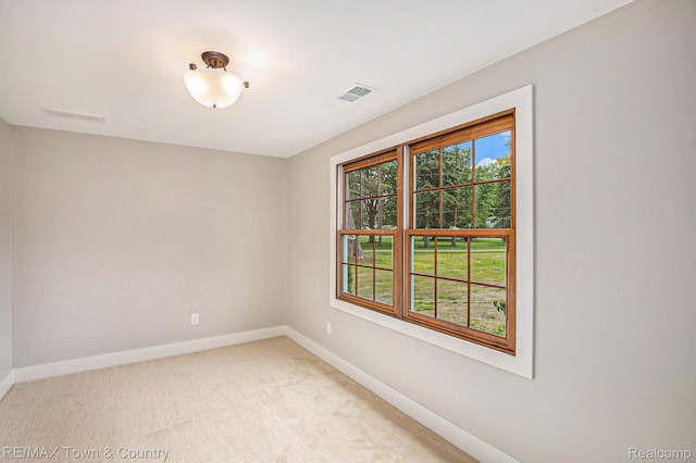 6400 N Seymour Rd, Flushing, MI 48433 - empty room featuring baseboards and light carpet