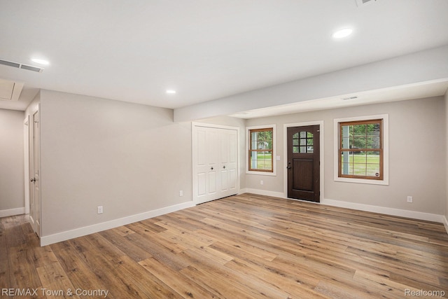 6400 N Seymour Rd, Flushing, MI 48433 - entryway with light wood-style flooring, baseboards, healthy amount of natural light, and recessed lighting