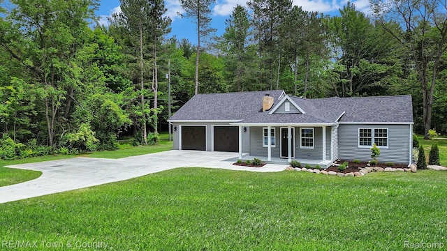 6400 N Seymour Rd, Flushing, MI 48433 - ranch-style house with a porch, driveway, a garage, and a front yard