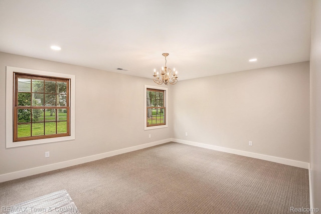 6400 N Seymour Rd, Flushing, MI 48433 - carpeted empty room featuring a chandelier, healthy amount of natural light, baseboards, and recessed lighting