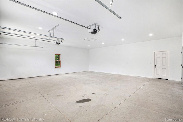 6400 N Seymour Rd, Flushing, MI 48433 - garage featuring a garage door opener and recessed lighting