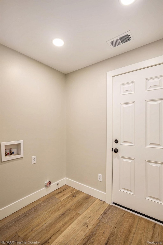 6400 N Seymour Rd, Flushing, MI 48433 - washroom with hookup for a washing machine, light wood-style floors, baseboards, and recessed lighting