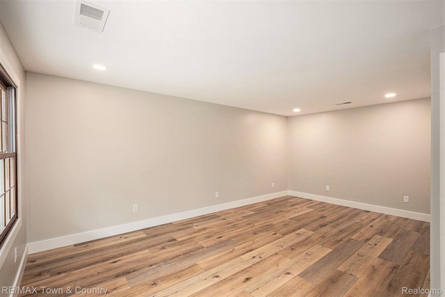 6400 N Seymour Rd, Flushing, MI 48433 - unfurnished room with recessed lighting, light wood finished floors, and baseboards