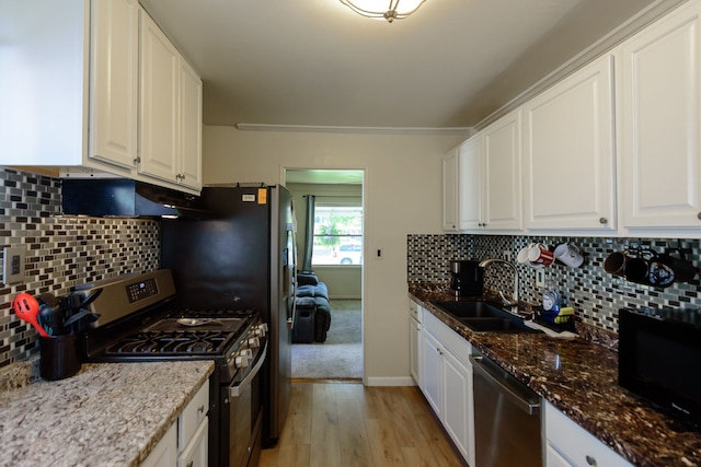 24690 Annapolis St, Dearborn Heights, MI 48125 - kitchen featuring appliances with stainless steel finishes, a sink, white cabinets, light wood finished floors, and crown molding