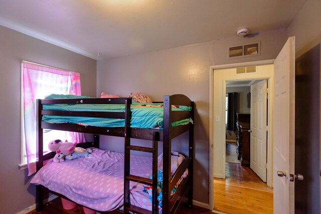 24690 Annapolis St, Dearborn Heights, MI 48125 - bedroom featuring wood finished floors and baseboards
