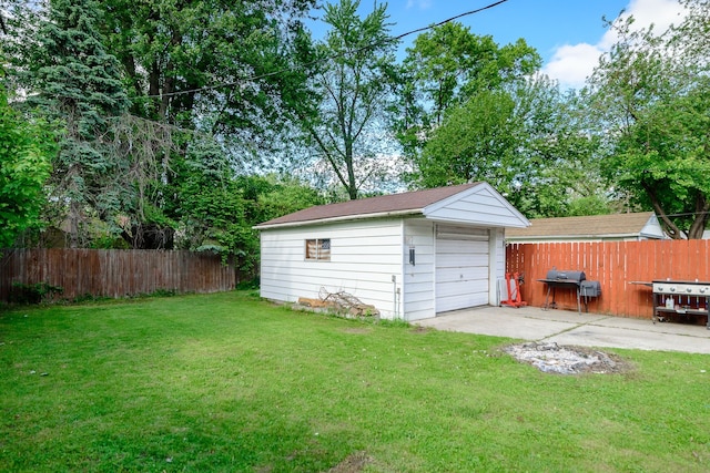 24690 Annapolis St, Dearborn Heights, MI 48125 - view of yard with driveway, a detached garage, and an outdoor structure