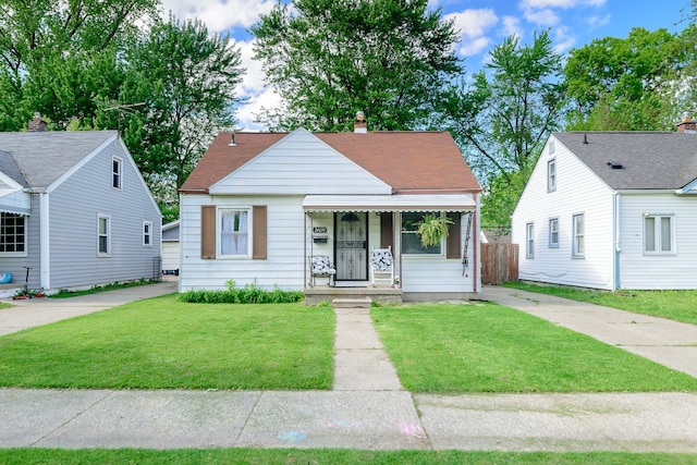 24690 Annapolis St, Dearborn Heights, MI 48125 - bungalow-style house featuring a chimney