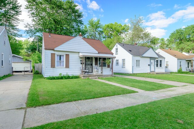 24690 Annapolis St, Dearborn Heights, MI 48125 - bungalow-style home featuring a front yard, a chimney, and a porch
