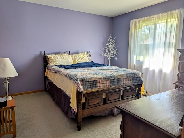 19 Old Mill Dr Unit 12, Holland, MI 49423 - bedroom featuring light carpet and baseboards