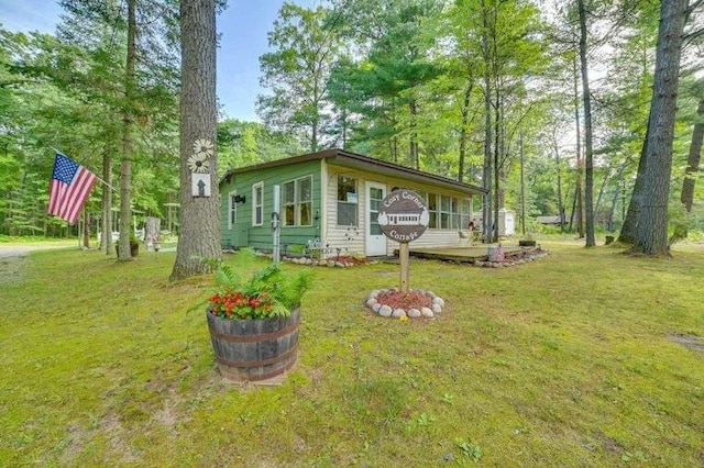 4290 Clark St, Lewiston, MI 49756 - view of front of property featuring a front lawn