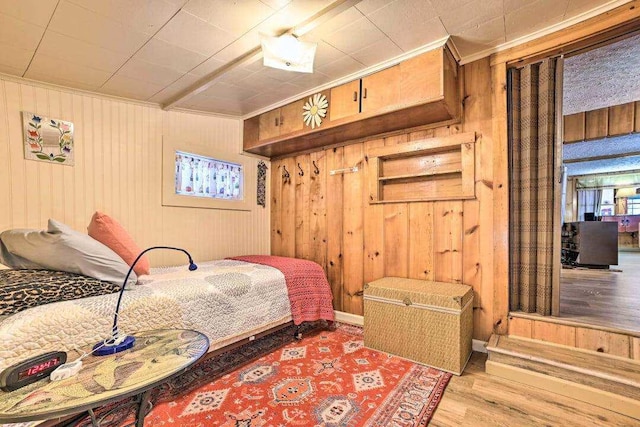 4290 Clark St, Lewiston, MI 49756 - bedroom with wood finished floors, crown molding, and wood walls