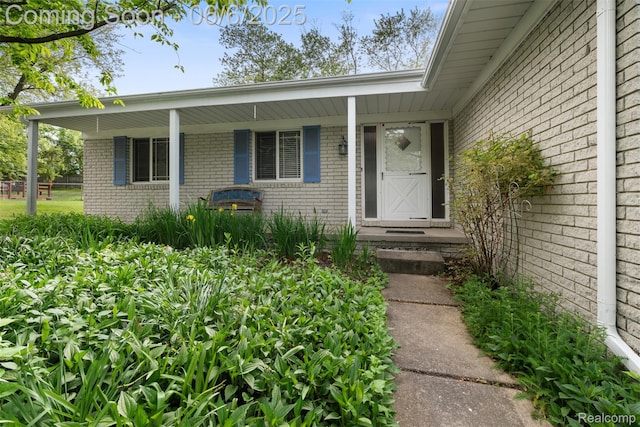 36963 Heatherton Dr, Farmington, MI 48335 - doorway to property with brick siding and covered porch