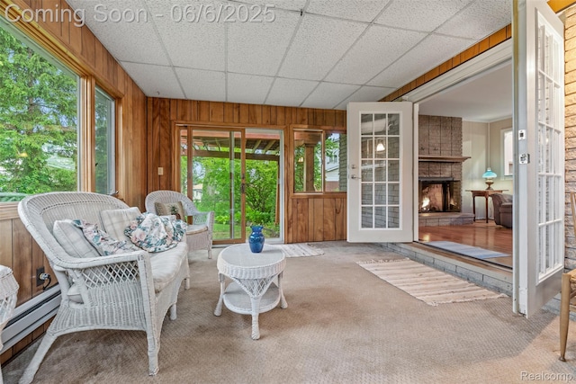 36963 Heatherton Dr, Farmington, MI 48335 - sunroom with healthy amount of natural light, french doors, a baseboard radiator, and a large fireplace