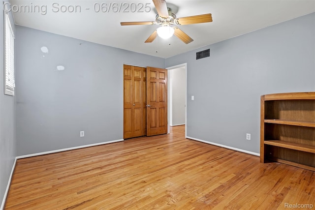 36963 Heatherton Dr, Farmington, MI 48335 - unfurnished bedroom featuring wood finished floors, baseboards, ceiling fan, and a closet