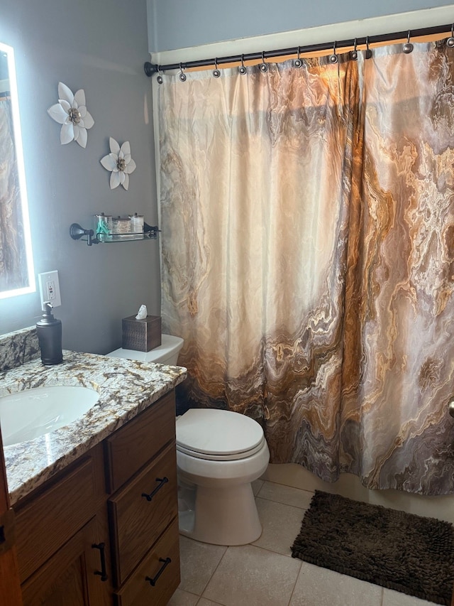 6523 Jones Rd, North Branch, MI 48461 - full bath with tile patterned floors, vanity, and toilet