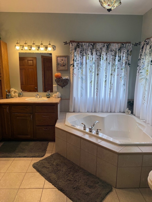 6523 Jones Rd, North Branch, MI 48461 - bathroom featuring tile patterned flooring, vanity, and a garden tub