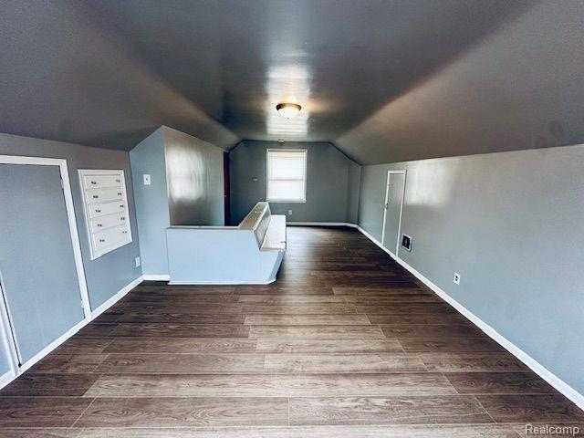 20250 Winthrop St, Detroit, MI 48235 - bonus room featuring vaulted ceiling, wood finished floors, and baseboards