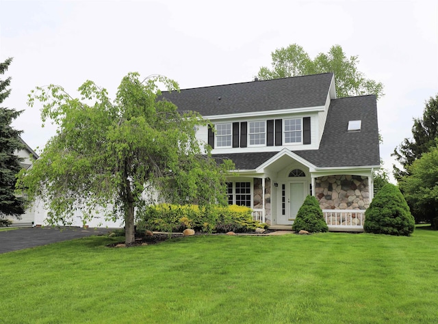 4116 Split Rail Dr, Fenton, MI 48430 - view of front of property with stone siding, a front lawn, a shingled roof, asphalt driveway, and a porch