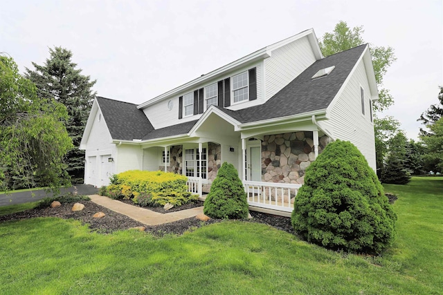 4116 Split Rail Dr, Fenton, MI 48430 - traditional-style home with a porch, stone siding, a shingled roof, a front yard, and an attached garage