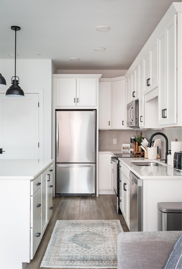 222 E State St, Traverse City, MI 49684 - kitchen featuring stainless steel appliances, a sink, and white cabinets