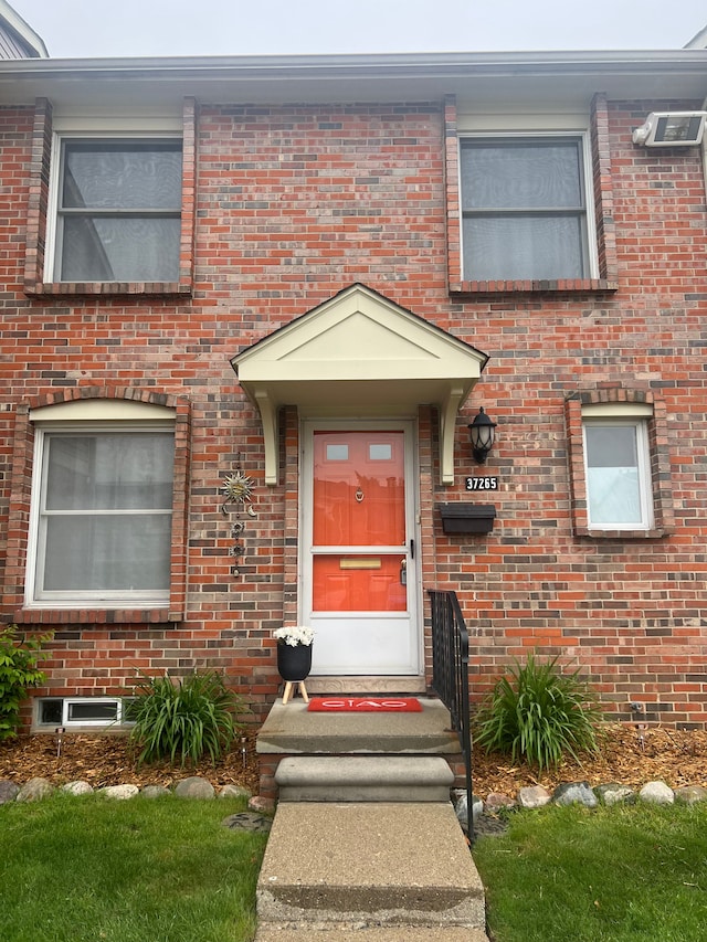 37265 Great Oaks Ct, Clinton Township, MI 48036 - doorway to property featuring brick siding
