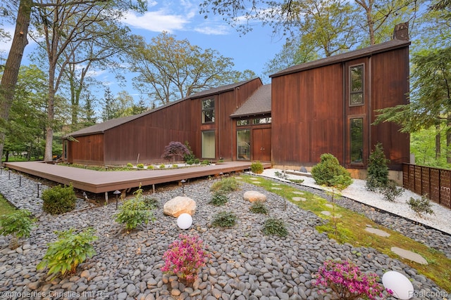 7371 Lindenmere Dr, Bloomfield Hills, MI 48301 - exterior space with a wooden deck and a chimney