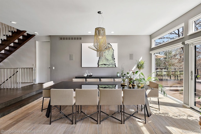 7371 Lindenmere Dr, Bloomfield Hills, MI 48301 - dining area featuring wood-type flooring, recessed lighting, and stairs