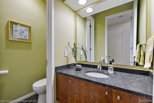 7371 Lindenmere Dr, Bloomfield Hills, MI 48301 - bathroom with vanity, toilet, and baseboards
