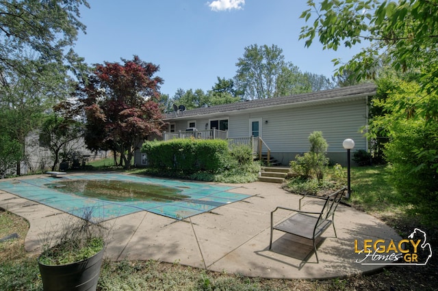 3051 Lantana Ct SE, Kentwood, MI 49512 - view of swimming pool with a covered pool, a patio, and a diving board