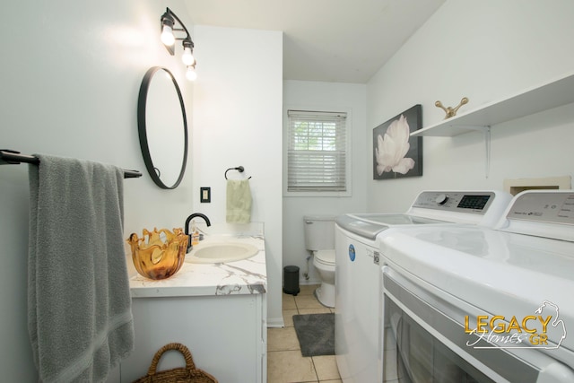 3051 Lantana Ct SE, Kentwood, MI 49512 - bathroom with independent washer and dryer, tile patterned flooring, toilet, and vanity