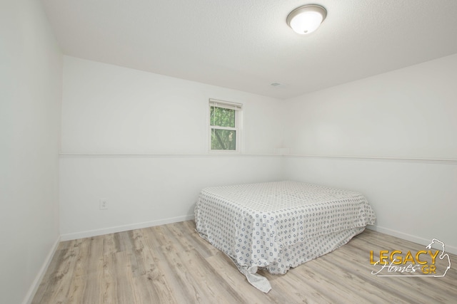 3051 Lantana Ct SE, Kentwood, MI 49512 - bedroom featuring wood finished floors and baseboards