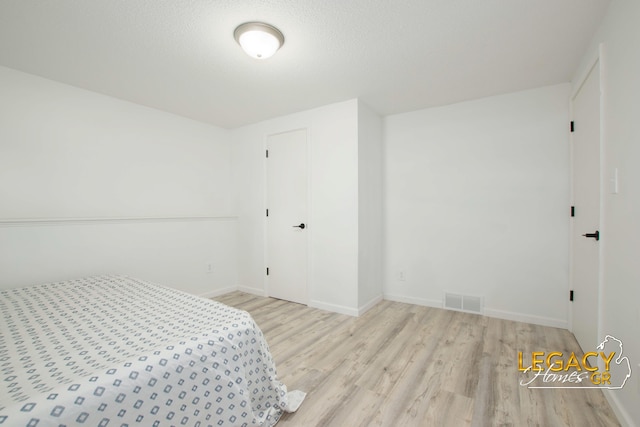 3051 Lantana Ct SE, Kentwood, MI 49512 - bedroom with wood finished floors and baseboards