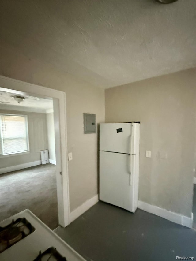 17167 Roselawn St, Detroit, MI 48221 - kitchen with freestanding refrigerator, baseboards, and electric panel