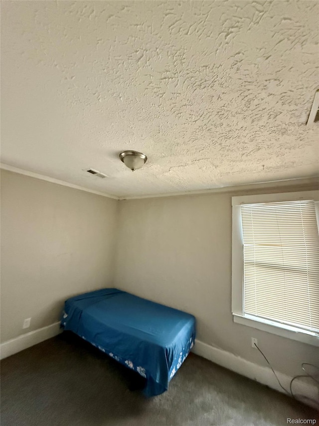 17167 Roselawn St, Detroit, MI 48221 - bedroom with a textured ceiling, baseboards, and carpet floors