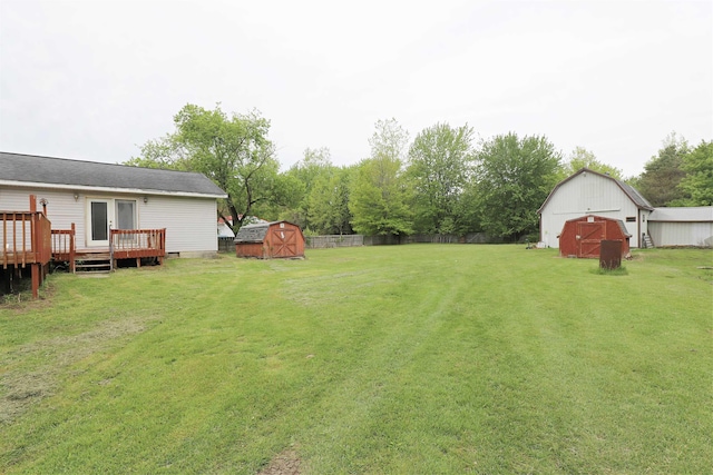 10432 W Wilson Rd, Montrose, MI 48457 - view of yard with a wooden deck