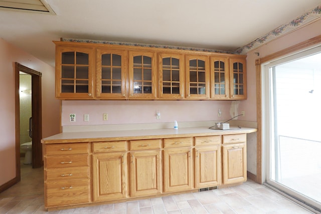 10432 W Wilson Rd, Montrose, MI 48457 - kitchen featuring glass insert cabinets and light countertops