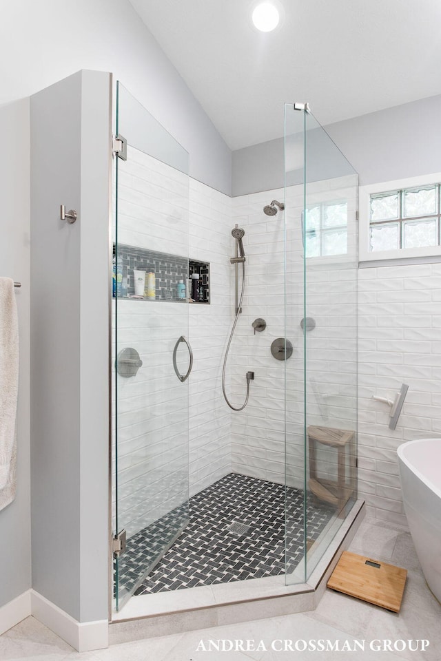 16993 Firefly Rdg, West Olive, MI 49460 - bathroom featuring a stall shower and a freestanding bath