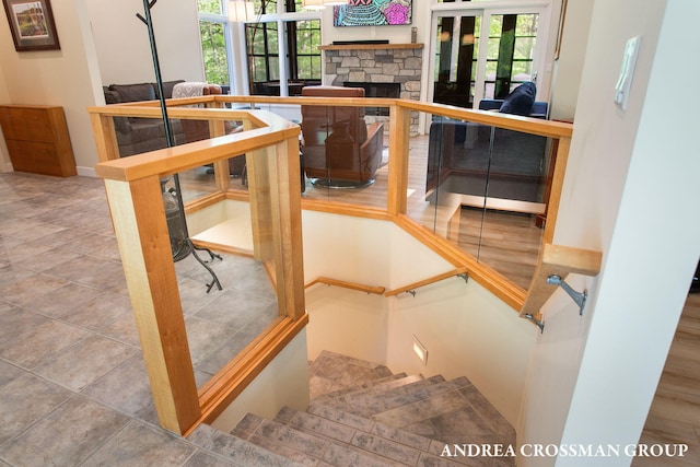 16993 Firefly Rdg, West Olive, MI 49460 - stairway featuring plenty of natural light, a fireplace, and baseboards