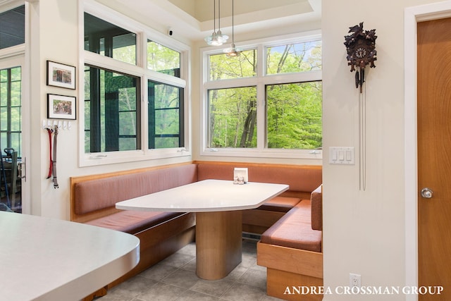 16993 Firefly Rdg, West Olive, MI 49460 - tiled dining space featuring breakfast area and radiator